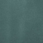 Detail of velvet fabric yardage in turquoise.