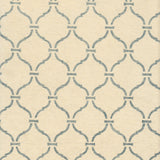 Detail of wallpaper in a curvilinear lattice print in blue-gray on a cream field.