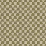 Detail of printed fabric in a watercolor ikat-inspired checkerboard pattern in tonal muted olive green.