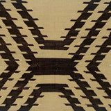 Handwoven rug with geometric pattern in black and beige