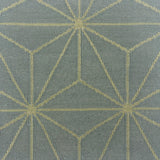 Handmade flatweave rug with linear star lattice design in cream on a light blue field.