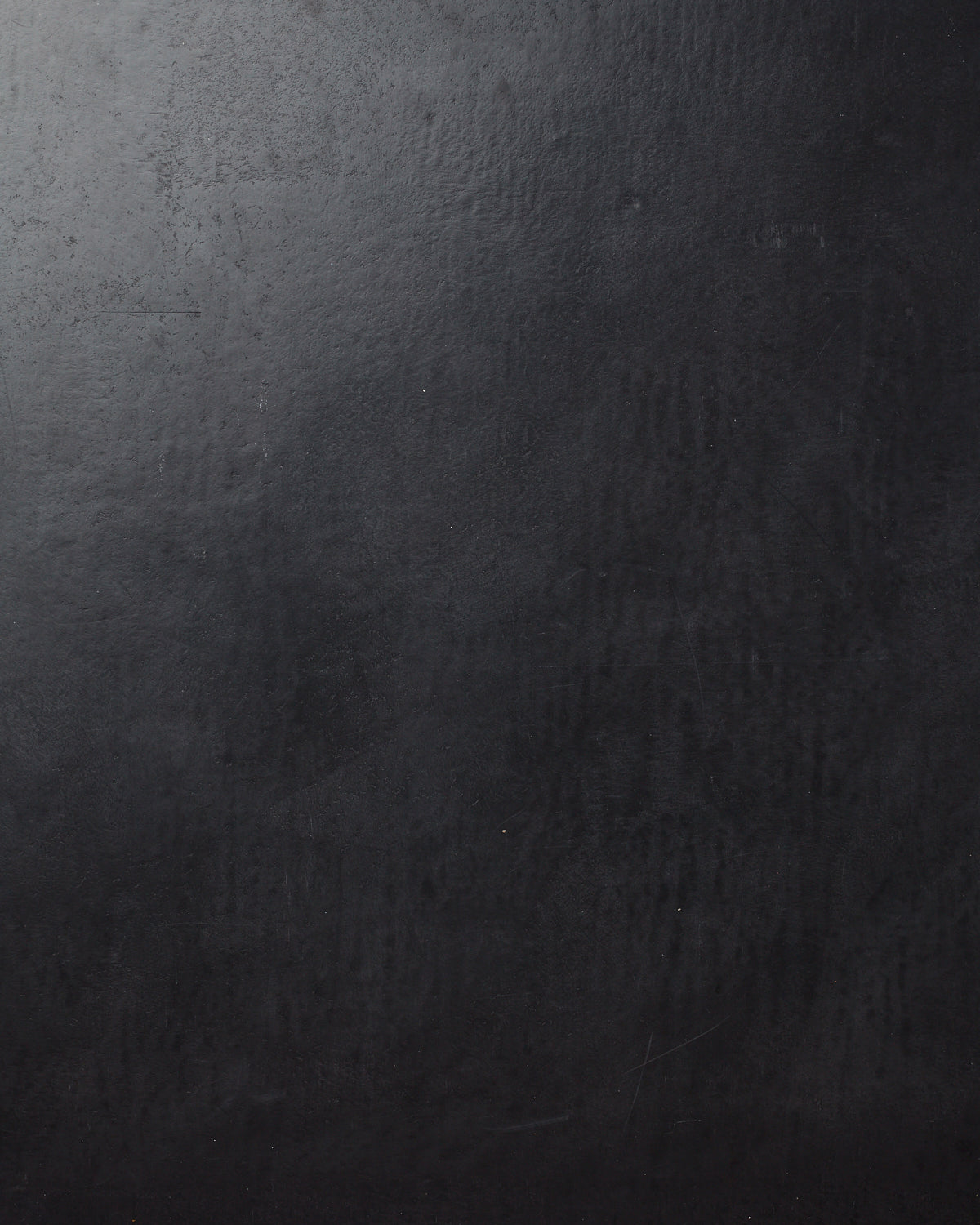 Detail of wallpaper in a glossy black leather.