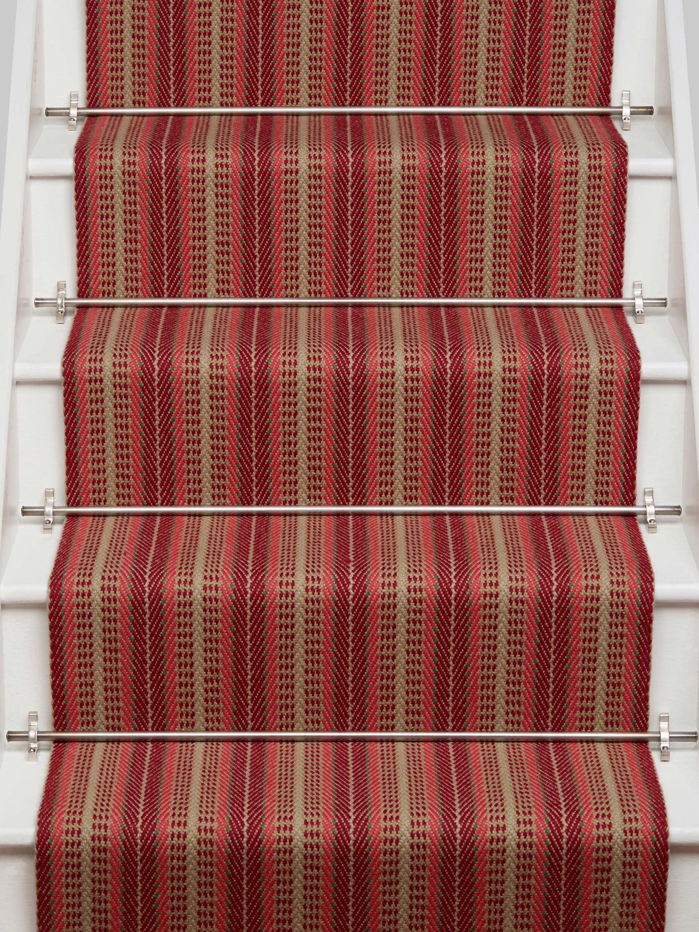 Striped flatweave runner in red and tan on white staircase