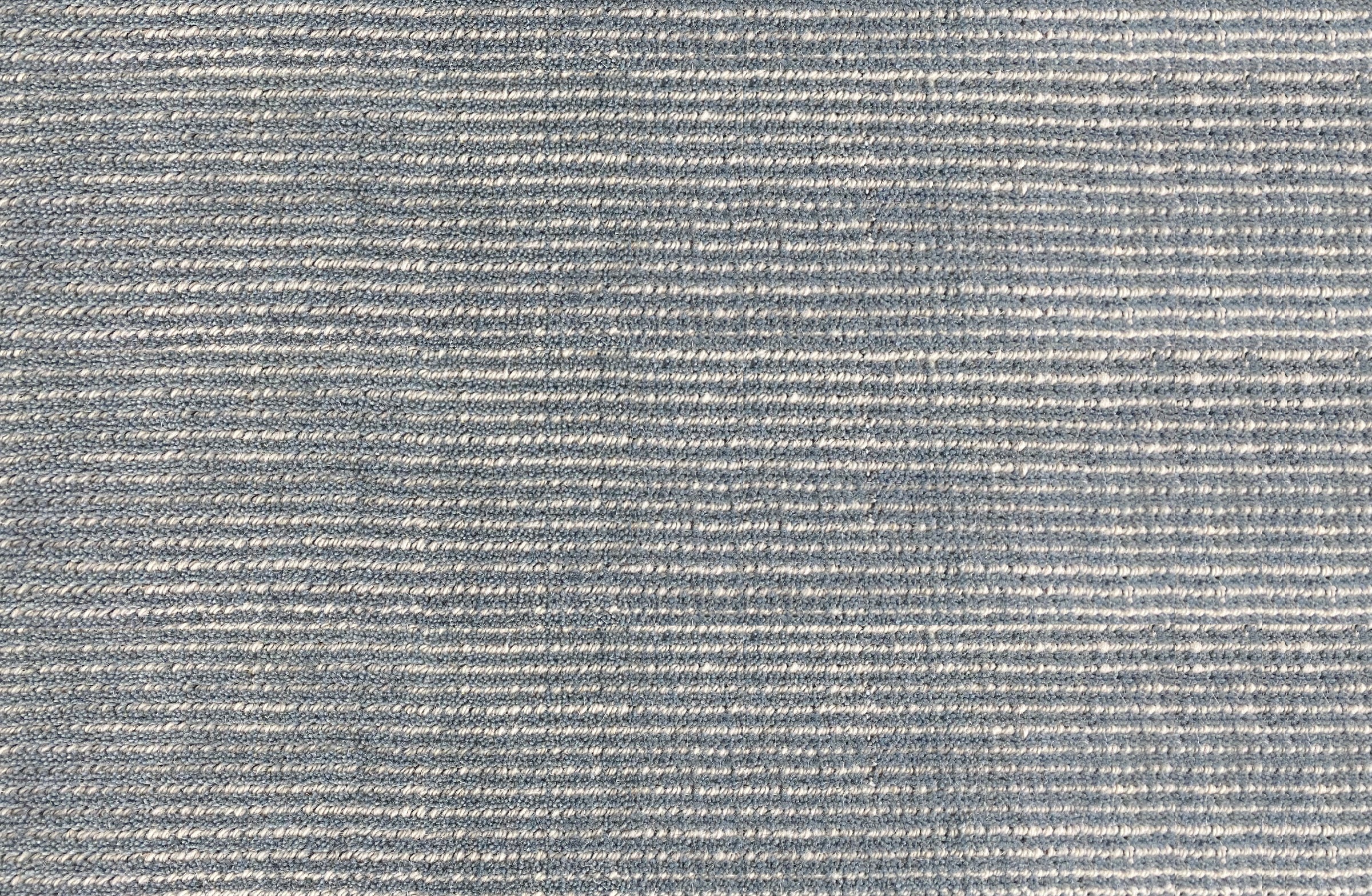 Broadloom carpet in subtle stripe in slate blue