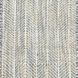 Close up of broadloom carpet with striated herringbone weave in white with accents of blue and green. 