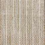 Close up of broadloom carpet with striated herringbone weave in white with accents of tan and brown.