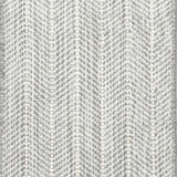 Close up of broadloom carpet with striated herringbone weave in white with accents of light grey.