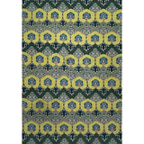 Patterned rug with green and blue botanical design on a white background