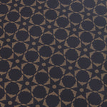 Wallpaper detail in a floral lattice print in  kraft brown on a navy field