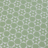 Wallpaper detail in a floral lattice print in  jade green on a cream field.
