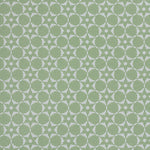 Wallpaper in a floral lattice print in  jade green on a cream field.