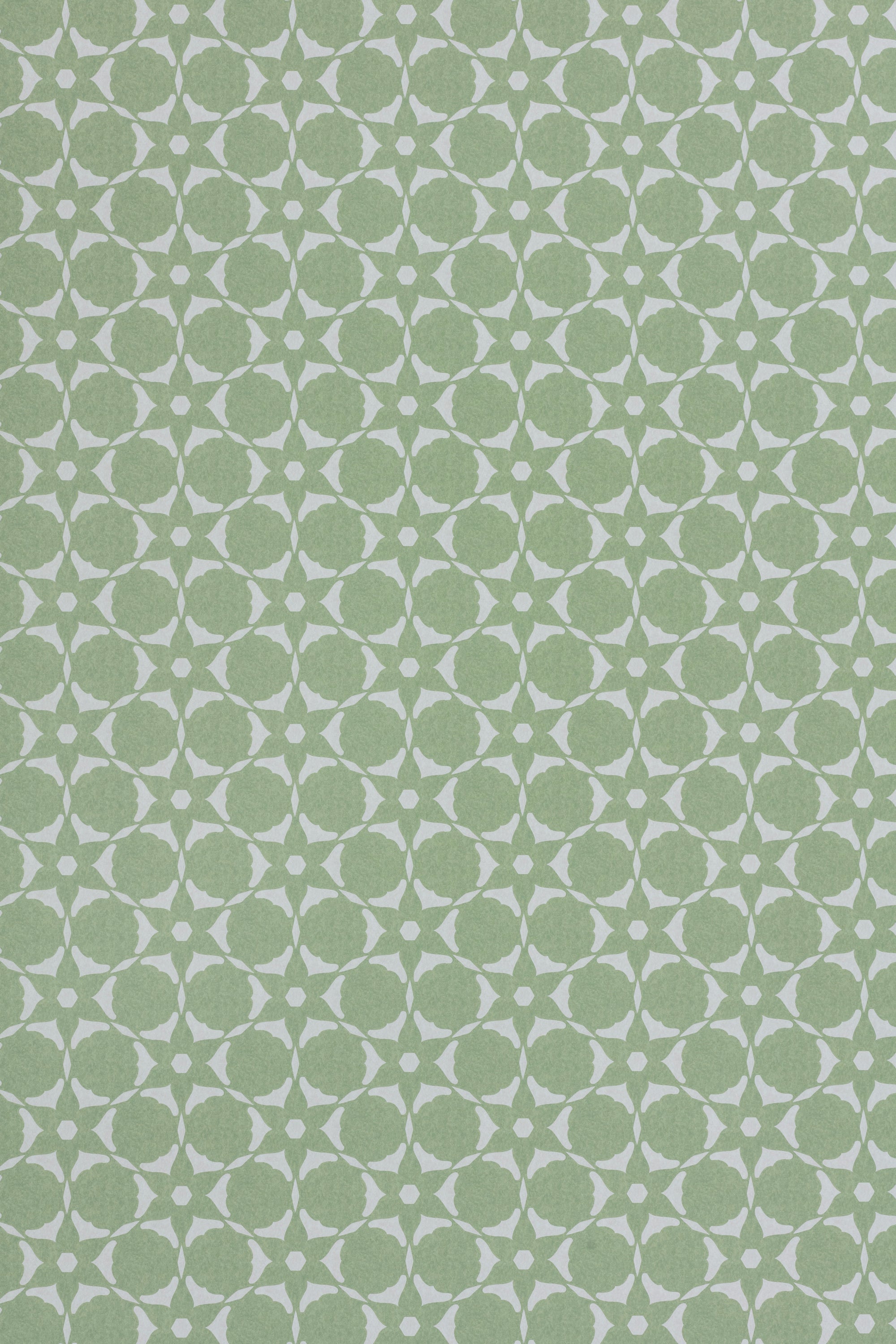 Wallpaper in a floral lattice print in  jade green on a cream field.