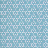 Wallpaper in a floral lattice print in  cream on a powder blue field.