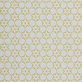 Wallpaper in a floral lattice print in  yellow on a cream field