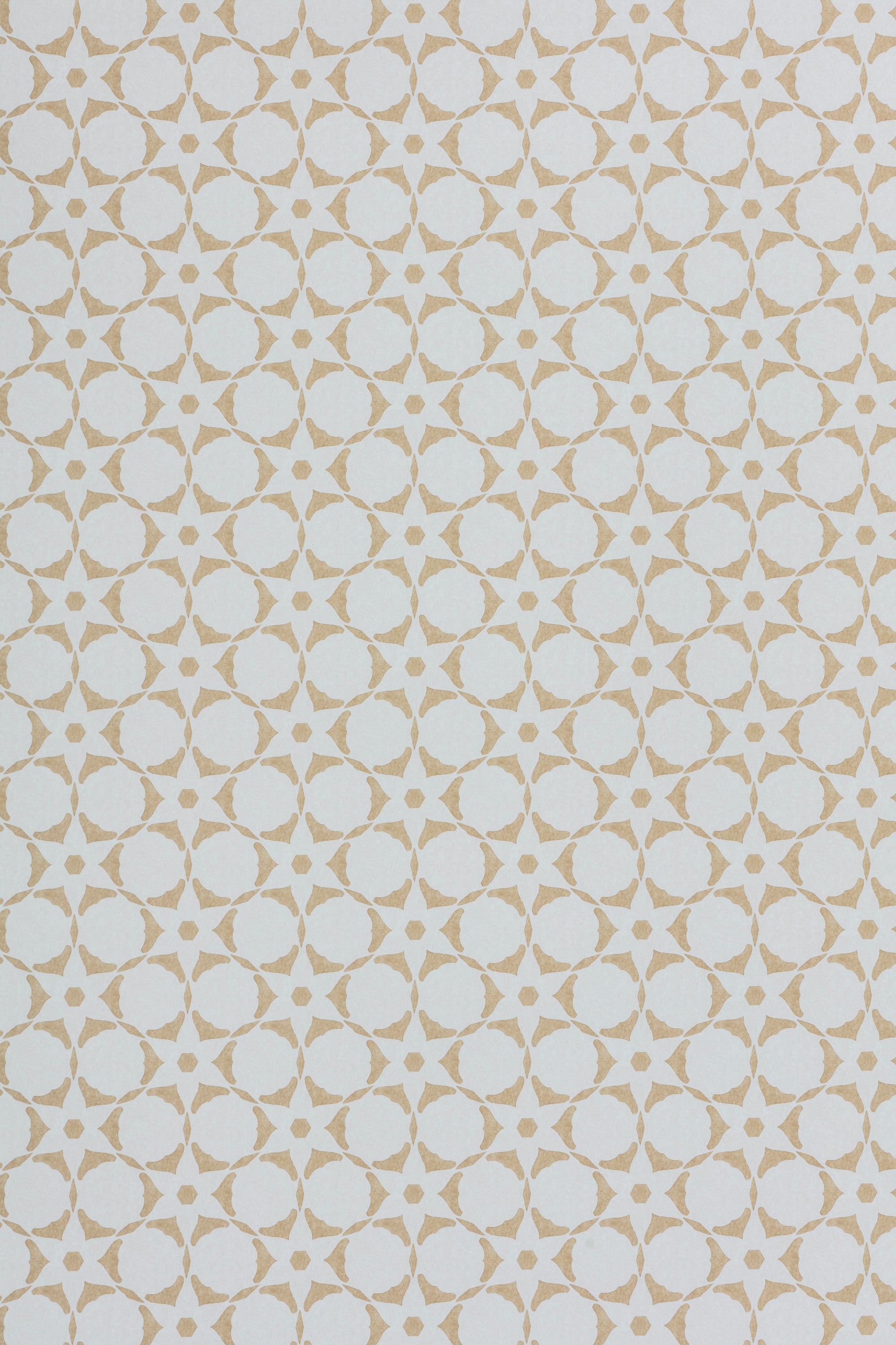 Wallpaper in a floral lattice print in tan on a cream field.