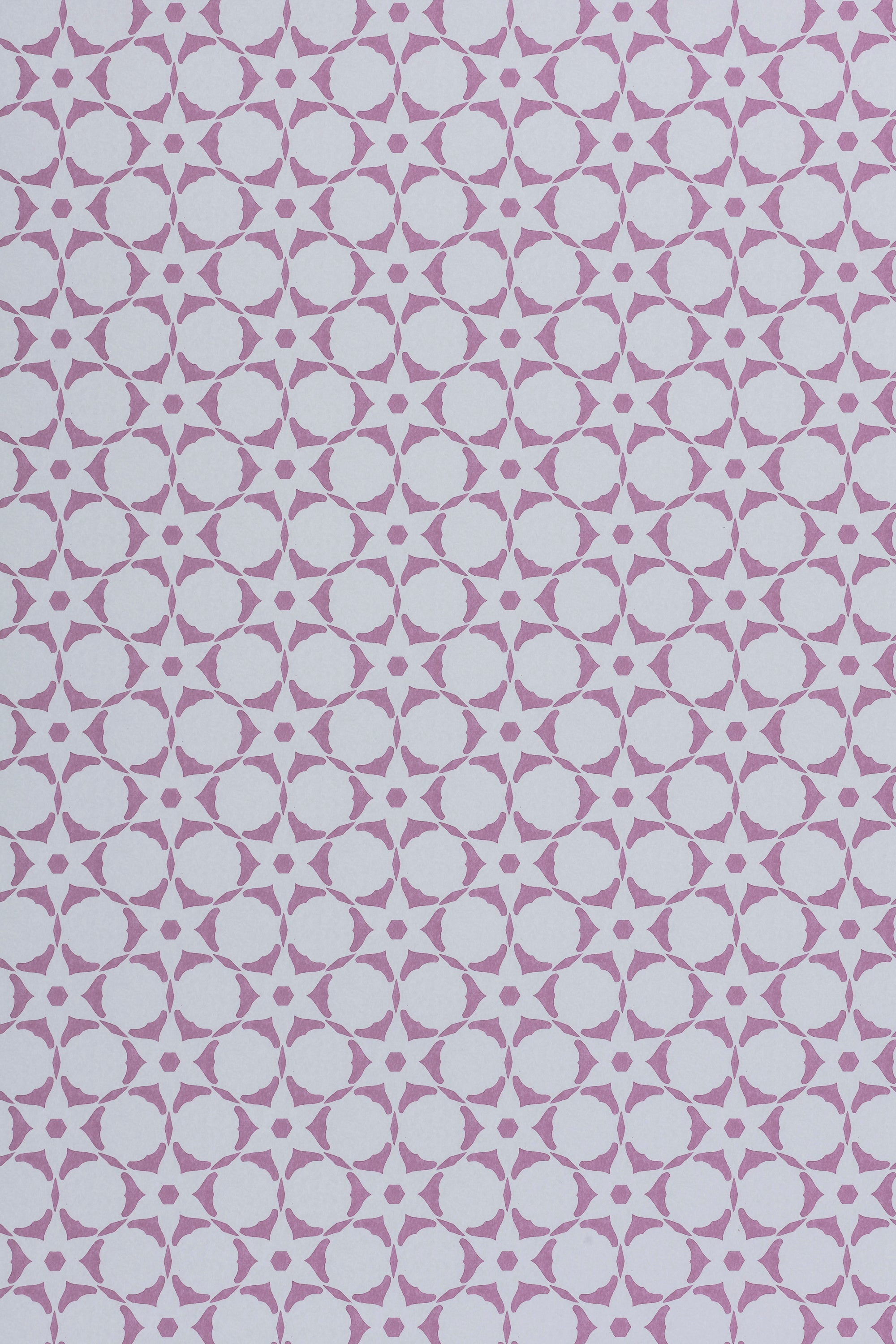 Wallpaper in a floral lattice print in purple on a cream field.