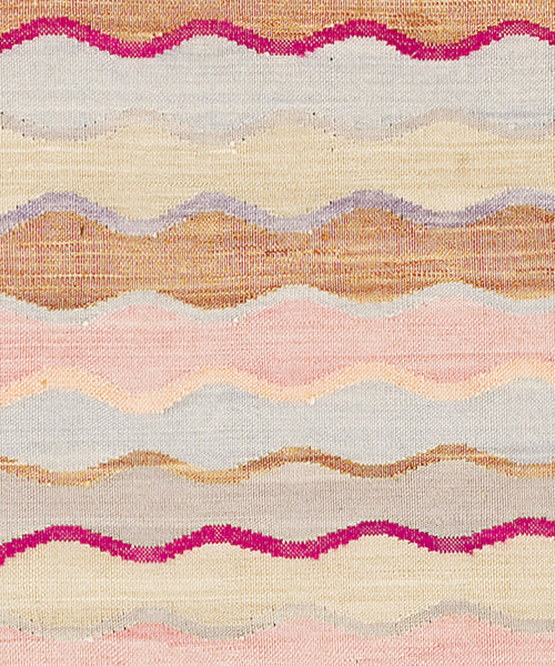 Flatweave Rug with wavy stripes of prink, orange, blue and tan.