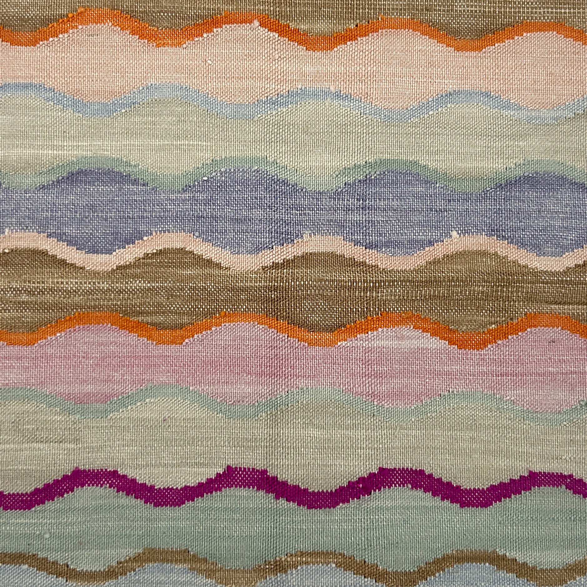 Multicolored wavy patterned rug with various colors.