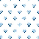 Detail of wallpaper in a playful bouquet print in blue and navy on a white field.