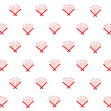 Detail of wallpaper in a playful bouquet print in orange and red on a white field.