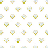 Detail of fabric in a playful bouquet print in blue and mustard on a white field.