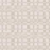 Detail of wallpaper in a large-scale checked pattern in shades of cream and tan.