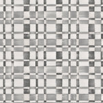 Detail of wallpaper in a large-scale checked pattern in shades of gray and white.