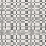 Detail of wallpaper in a large-scale checked pattern in shades of gray and white.
