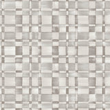 Detail of fabric in a large-scale checked pattern in shades of greige.