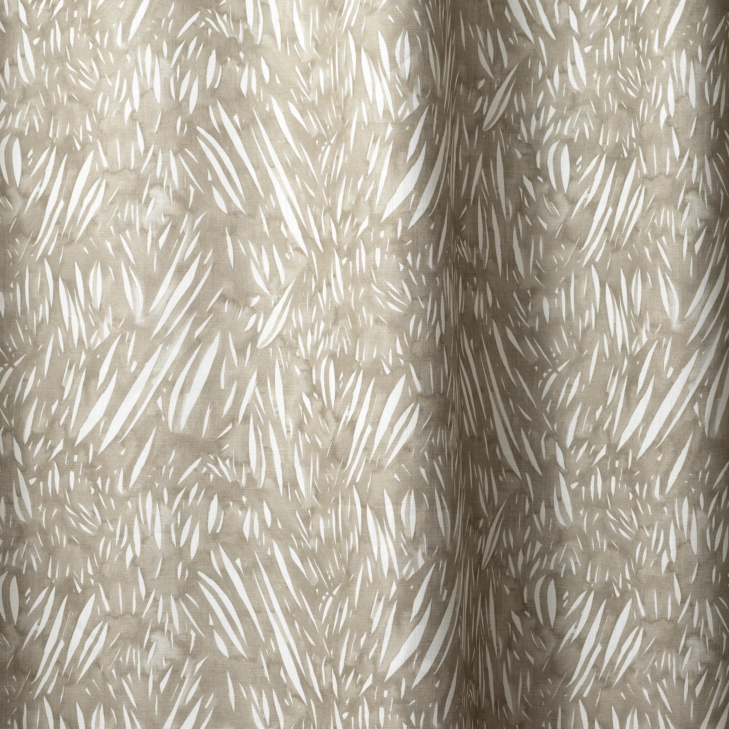 Draped linen in  an abstract leaf pattern in white on a taupe grey watercolor field.