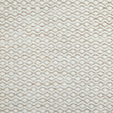 Flatweave rug in a small scale zigzag dot stripe in cream on a warm beige field.