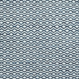 Flatweave rug in a small scale zigzag dot stripe in cream on a navy blue field.