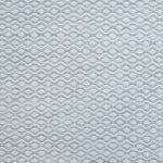 Flatweave rug in a small scale zigzag dot stripe in cream on a light grey field.