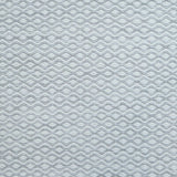 Flatweave rug in a small scale zigzag dot stripe in cream on a light grey field.