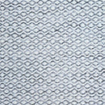 Flatweave rug in a small scale zigzag dot stripe in cream on a heather charcoal field.