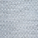 Flatweave rug in a small scale zigzag dot stripe in cream on a heather charcoal field.