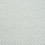 Flatweave rug in a small scale zigzag dot stripe in cream on a pale ecru field.