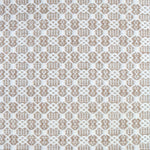 Flatweave rug in a small scale decorative lattice design in cream on a tan field. 