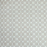 Flatweave rug in a small scale decorative lattice design in cream on a grey and tan field. 