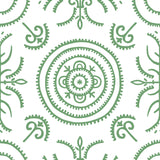 Detail of wallpaper in a playful medallion print in green on a white field.