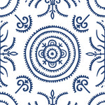 Detail of wallpaper in a playful medallion print in navy on a white field.
