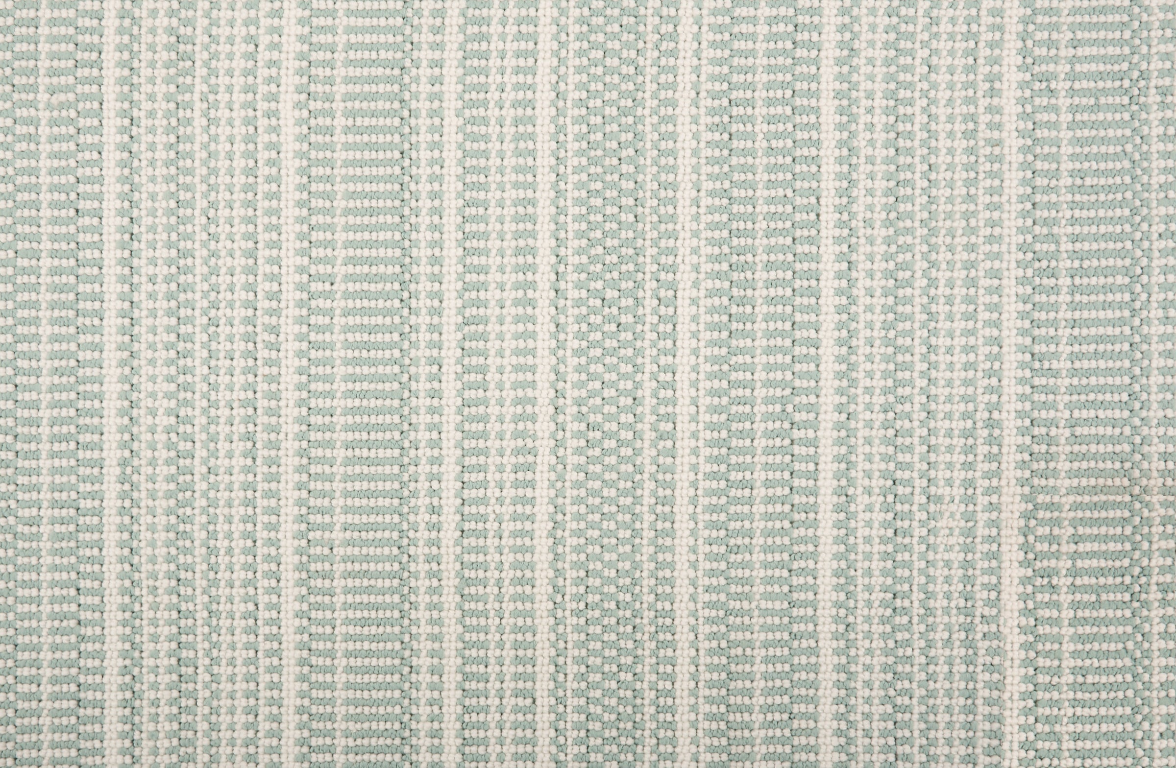 Broadloom carpet in  textural stripe design in white and seafoam green.