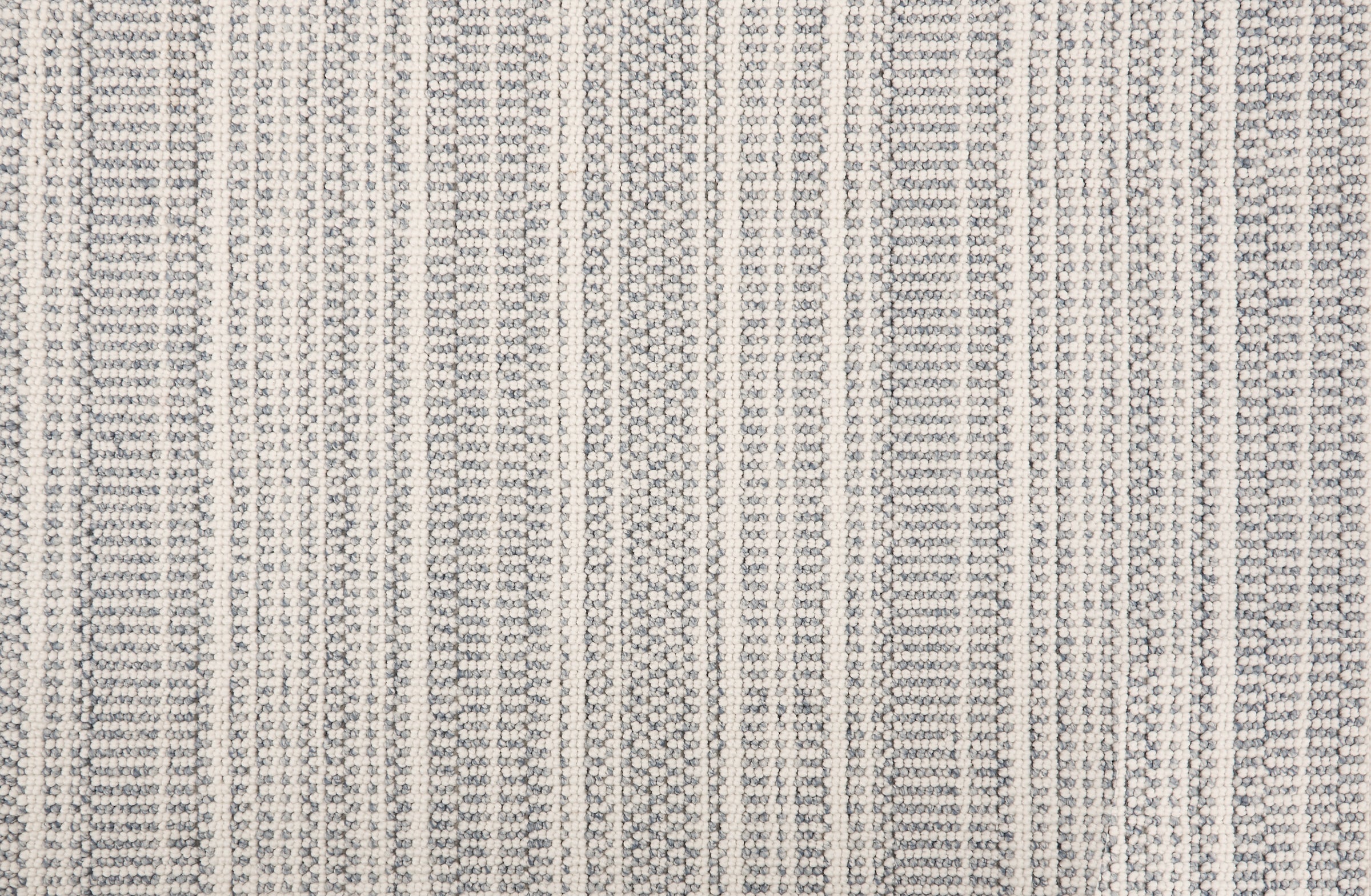 Broadloom carpet in  textural stripe design in white and blue-grey.