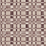 Wallpaper in a large-scale checked pattern in shades of wine purple and beige.