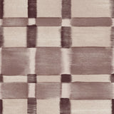 Detail of wallpaper in a large-scale checked pattern in shades of wine purple and beige.
