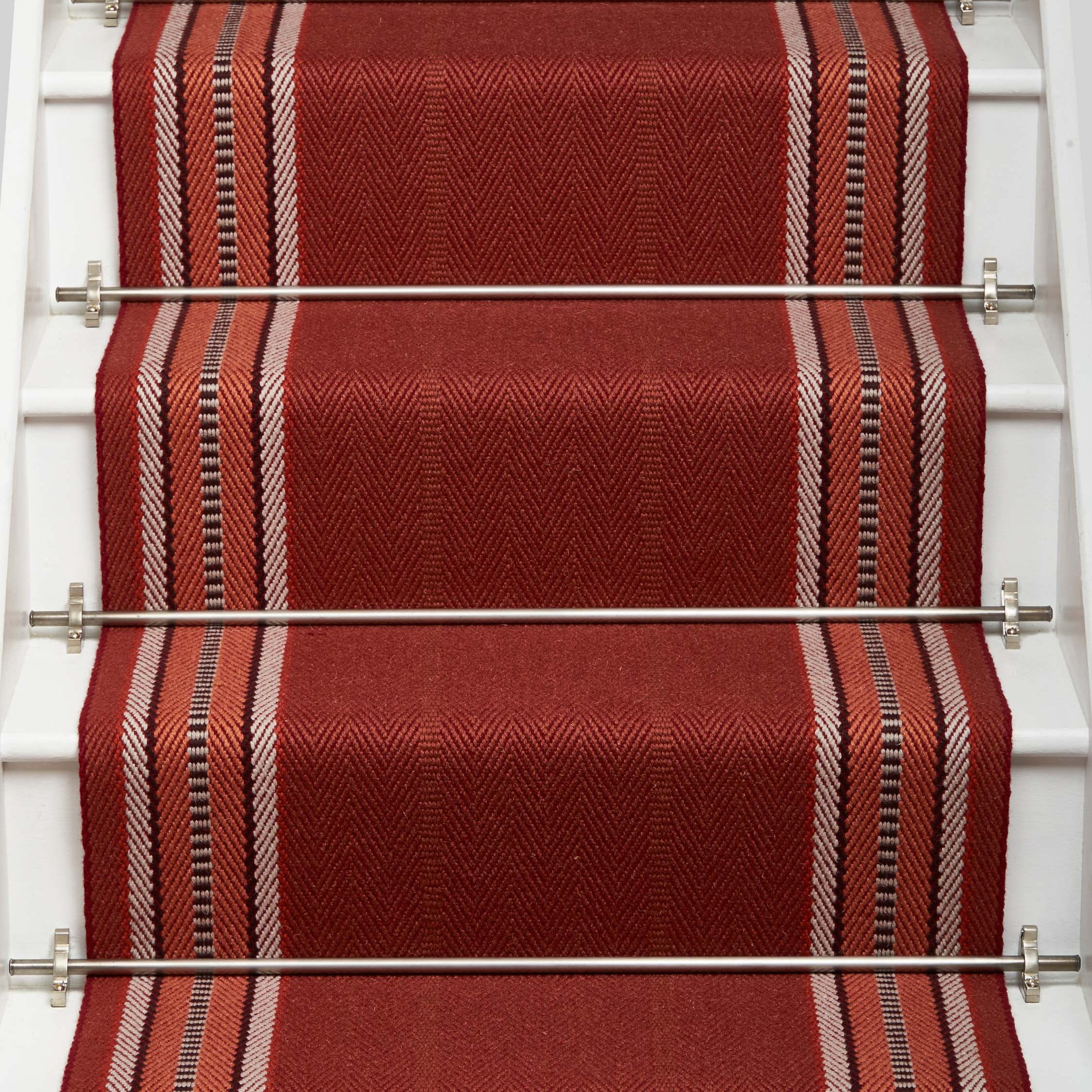 Striped flatweave runner in red on white staircase