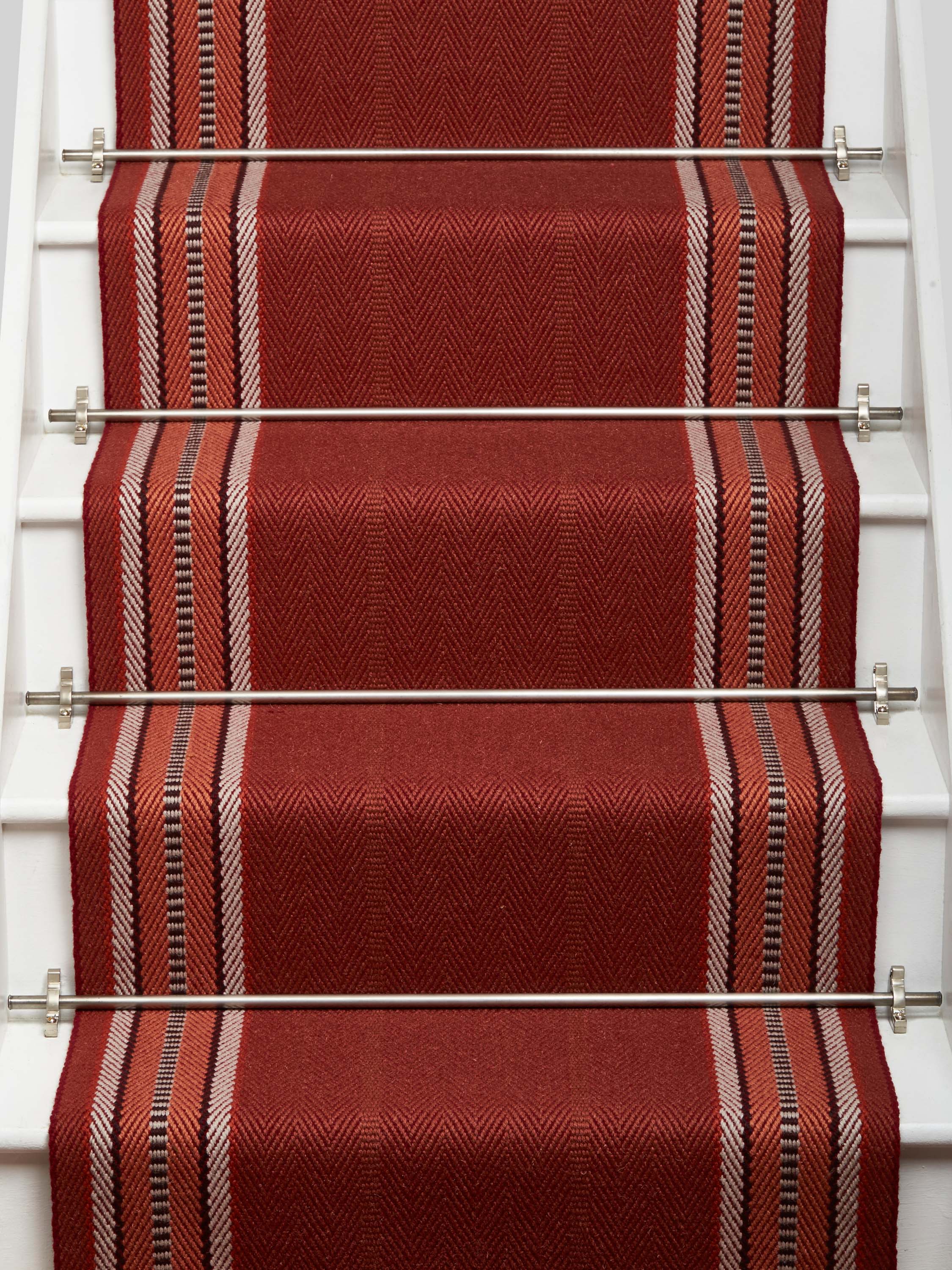 Striped flatweave runner in red on white staircase