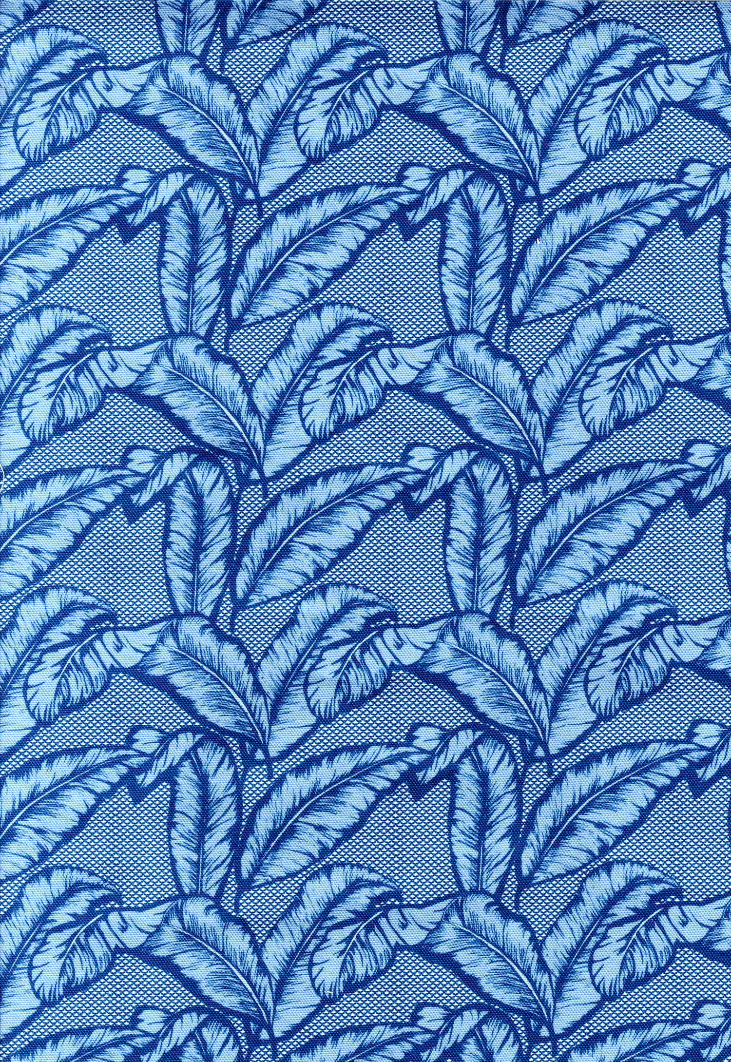 Detail of fabric in a dense leaf print in navy and blue on a blue field.