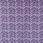 Detail of fabric in a dense leaf print in shades of purple on a purple field.