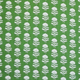 Detail of fabric in a repeating thistle print in white and green on a green field.